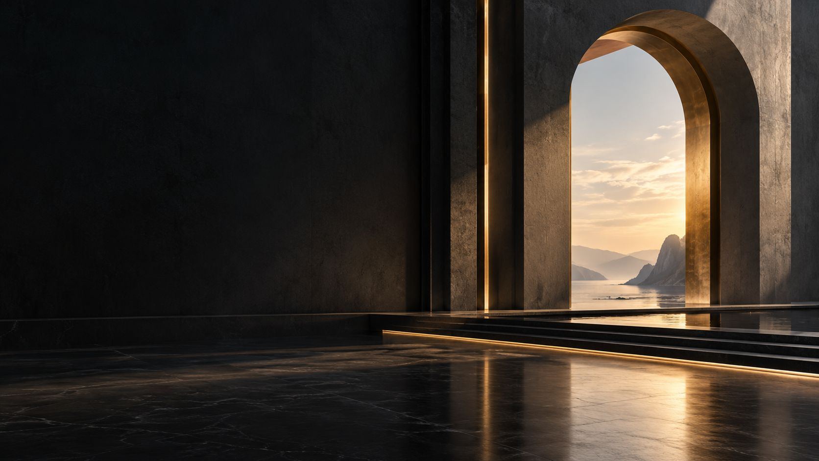 A stone archway opening onto mountains and water at sunset
